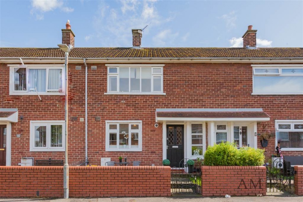 A red brick, terrace property in East Belfast. This house has two storeys and a small enclosed garden to the front.