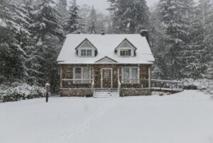 House in the snow. Image used in the Saving money on your heating bills over winter blog post