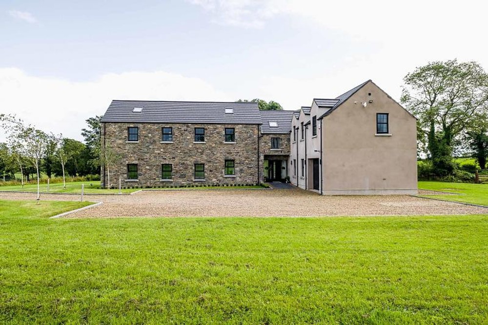 The exterior of 96 Ballywillin Road, a large detached home for sale in Derryboy. Image used in the 8 beautiful country homes for sale in Northern Ireland blog post.